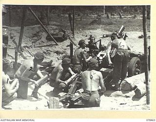 BOUGAINVILLE ISLAND, 1945-01-21. TROOPS OF NO.4 BATTERY, 2ND FIELD REGIMENT, AT THEIR ACTION STATIONS. IDENTIFIED PERSONNEL ARE:- VX82243 BOMBARDIER J. CHARMAN (1); VX70158 GUNNER S.H. MOUNSEY (2); ..