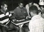 Dominoes, one of the favorite games of Caledonian people which is gathering friends on the evening