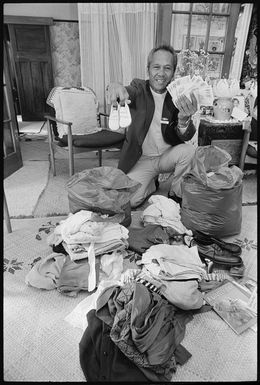 Reverend Jimmy Kiriau with clothes and books for the Cook Islands