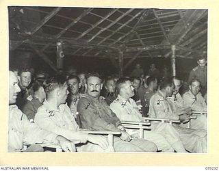 KALUMALAGI RIVER, NEW BRITAIN. 1945-02-24. VX27 MAJOR- GENERAL A.H. RAMSAY, CBE, DSO, ED, GENERAL OFFICER COMMANDING 5TH DIVISION (4) AND THE OFFICIAL PARTY AT THE OPENING OF THE NEW RECREATION HUT ..