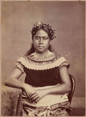 Young woman sitting at table. From the album: Tahiti, Samoa and New Zealand scenes