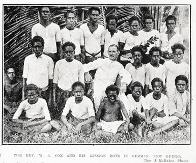 The Rev W A Cox and his mission boys in German New Guinea