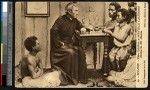 Missionary father at a desk with young indigenous students, New Caledonia, ca.1900-1930