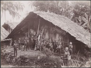 Children standing in front of a gamal at Te Motu, Santa Cruz Islands, 1906 / J.W. Beattie