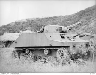 RABAUL, NEW BRITAIN. 1945-09-14. A TYPE 2 KA-MI AMPHIBIOUS TANK CAPTURED AT RABAUL (RIGHT SIDE VIEW SHOWING NUMBERS ON THE TURRETS AND WITHOUT FLOTATION PODS AFFIXED). IT IS ONE OF SEVERAL LIGHT ..