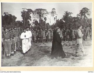 TOROKINA, BOUGAINVILLE. 1945-10-03. DR WADE, OF USA, BISHOP OF THE SOLOMON ISLANDS, IN THE PROCESSION TO THE ALTAR DURING THE SOLEMN HIGH MASS OF THANKSGIVING FOR PEACE ATTENDED BY HEADQUARTERS 3 ..