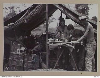 WOM, WEWAK AREA, NEW GUINEA. 1945-05-09. THE COMMAND POST, D TROOP, 2 BATTERY, 2/1 FIELD REGIMENT, IN ACTION WHILE 25-POUNDERS PROVIDE COVERING FIRE FOR THE FINAL ASSAULT ON WEWAK. IDENTIFIED ..