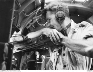 412946 Flight Lieutenant Arthur Frederick Goodall, Wireless Gunner, 100 Squadron RAAF, of Lismore, manning a Vickers gas operated gun in the waist position in Beaufort Bomber Ag-633 QHZ,  in flight ..