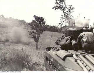 GUSIKA, NEW GUINEA. 1944-03-15. A MATILDA TANK FROM THE 1ST TANK BATTALION, FIRING A 3 INCH HOWITZER HIGH EXPLOSIVE 119 TO TEST THE VULNERIBILITY OF A CUPOLA FITTED TO THE BODY OF ANOTHER MATILDA ..