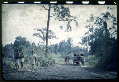 Native medical orderlys [i.e. orderlies]  & driver at Amboga double crossing near Sangara Observatory, [1951] Albert Speer