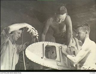 BOUGAINVILLE ISLAND, SOLOMON ISLANDS. 1945-01-12. 6638 LEADING AIRCRAFTMAN (LAC) C. E. GARTAN, BEENLEIGH, QLD, 24168 SERGEANT A. G. BAGGOTT, MAREEBA, QLD, AND 8773 LAC J. PAINTER, INDOOROOPILLY, ..