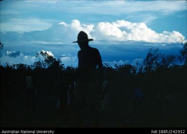 Silhouette of man in a hat
