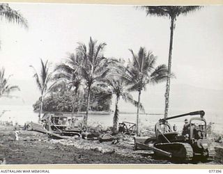 PALMALMAL PLANTATION, NEW BRITAIN. 1944-11-29. PERSONNEL OF THE 48TH DEPUTY COMMANDER, ROYAL ENGINEERS (WORKS) USING SOME OF THEIR HEAVY EQUIPMENT DURING THE BUILDING OF AN AIRSTRIP