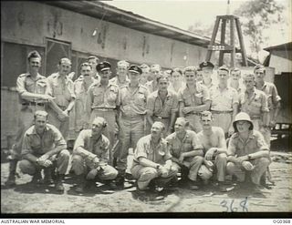 KIRIWINA, TROBRIAND ISLANDS, PAPUA. C. 1943-11. AN INFORMAL GROUP PORTRAIT OF CREWS OF NO. 22 (BOSTON) SQUADRON RAAF. BACK ROW: LEFT TO RIGHT: FLIGHT LIEUTENANT (FLT LT) L. WILLIAMSON, SURREY ..