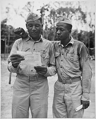 "First Negro Marines decorated by the famed Second Marine Division somewhere in the Pacific (left to right) Staff Sgt Timerlate Kirven...and Cpl. Samuel J. Love, Sr... They received Purple Hearts for wounds received in the Battle of Saipan..."