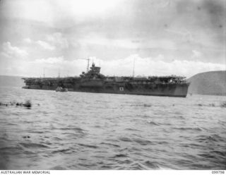 Rabaul, New Britain. 1946-01-31. The Japanese Navy aircraft carrier Katsuragi in Simpson Harbour. The ship was transporting 5000 Japanese troops from the Solomon Islands to Japan and had called at ..