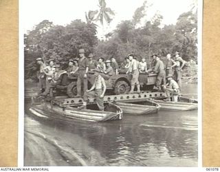 FINSCHHAFEN AREA, NEW GUINEA. 1943-11-11. RECENT HEAVY RAINS WASHED AWAY THE BRIDGE OVER THE BUMI RIVER, SO UNTIL A NEW BRIDGE CAN BE BUILT BY THE 2/3RD AUSTRALIAN FIELD COMPANY, ROYAL AUSTRALIAN ..