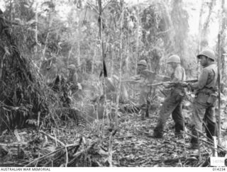 1943-01-27. PAPUA. SANANANDA AREA. A JAPANESE WAS SEEN BY A NATIVE BOY TO RUN INTO A DUGOUT FROM WHERE HE IMMEDIATELY OPENED FIRE AT AUSTRALIANS CARRYING AMMUNITIONS TOWARDS THE FRONT LINE AT BUNA. ..