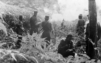 Members of the First Battalion Fiji Infantry Regiment, waiting for an air drop during the 1952 Malayan Emergency