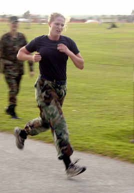 U.S. Air Force 36th Civil Engineering Squadron AIRMAN Kristin Byrd, sprints toward the finish line during Warrior Challenge Day at Arc Light Memorial Park, Andersen Air Force Base, Guam, on Jan. 14, 2005. (U.S. Air Force PHOTO by AIRMAN Teresa M. Pumphrey) (Released)