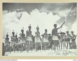 KELANOA, NEW GUINEA, 1944-02-20. 5TH DIVISION SIGNALS, THE WINNING TEAM, AT A BEACH CARNIVAL ORGANISED BY CAPTAIN A.E. RICHARDS AND SERGEANT P.J. HORAN OF THE AUSTRALIAN ARMY AMENITIES SERVICE, 5TH ..