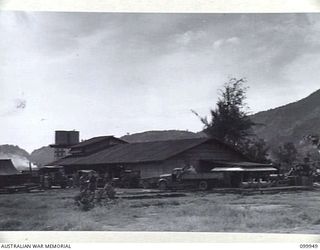 RABAUL, NEW BRITAIN, 1946-03-29. A GENERAL VIEW OF THE AUSTRALIAN ARMY CANTEENS SERVICE CORDIAL FACTORY IN MATAGUNA AVENUE. THE FACTORY, STAFFED BY SEVEN SKILLED ARMY PERSONNEL, A CHINESE AND ..