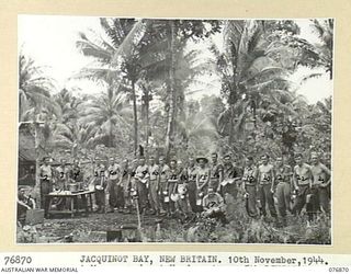 JACQUINOT BAY, NEW BRITAIN. 1944-11-10. A MESS PARADE AT HEADQUARTERS, 5TH DIVISION AT THE MALMAL MISSION. IDENTIFIED PERSONNEL ARE: N377688 PRIVATE M.S. GLANVILLE (1), WX39130 PRIVATE H.A. TUCKER ..