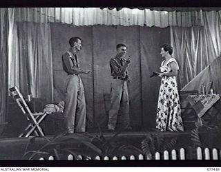 LAE, NEW GUINEA. 1944-12-01. MEMBERS OF THE ARMY EDUCATION SERVICE DRAMATIC GROUP ATTACHED TO 2/7TH AUSTRALIAN GENERAL HOSPITAL IN NOEL COWARD'S PLAY, "DESIGN FOR LIVING" IN THE THEATRE OF THE 22ND ..