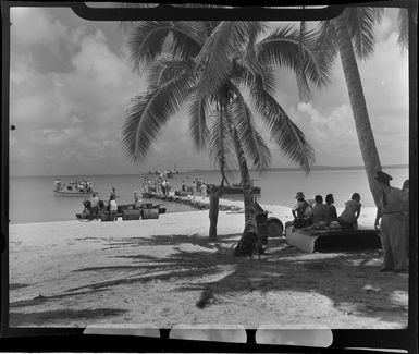 Crew and passengers are escorted to the TEAL (Tasman Empire Airways Limited) Flying boat, Akaiami, Aitutaki, Cook Islands
