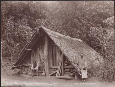 Two men at a house in Lakona, Santa Maria, Banks Islands, 1906 / J.W. Beattie