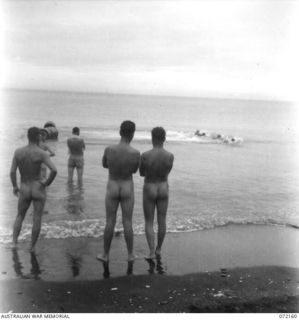 LAKONA, NEW GUINEA. 1944-04-08. THE START OF THE 33 YARDS SPRINT RACE AT THE 30TH INFANTRY BATTALION, 8TH INFANTRY BRIGADE SWIMMING CARNIVAL HELD AT LAKONA BEACH. COMPETITORS WAIT THEIR TURN WHILE ..