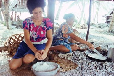 Women cooking outdoors, Tokelau
