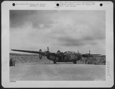 The Consolidated B-24 "Joltin' Janie" of the 403rd Bomb Squadron, 43rd Bomb Group, parked in a revetment at Dobodura Airstrip, Papua, New Guinea. 11 June 1943. (U.S. Air Force Number 72352AC)