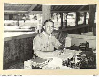 LAE, NEW GUINEA. 1944-10-18. NX110496 MAJOR A.E. BURGESS, CAMP COMMANDANT, 1ST AUSTRALIAN ARMY