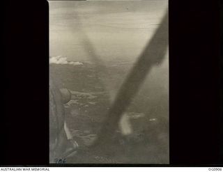 BISMARCK ARCHIPELAGO. 1944-03-28. PART OF NEW BRITAIN AS SEEN FROM A BEAUFIGHTER AIRCRAFT OF NO. 30 SQUADRON RAAF FLOWN BY FLIGHT SERGEANT T. BOEHM OF SA, AS ESCORT AIRCRAFT, OF NO. 79 (SPITFIRE) ..