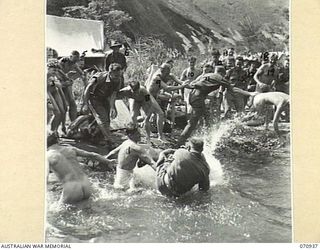 ZENAG, NEW GUINEA, 1944-02-27. THE FINAL EVENT AT THE SPORTS CARNIVAL ARRANGED BY THE 2/9TH FIELD COMPANY, ROYAL AUSTRALIAN ENGINEERS. THE CUE WAS THE ANNOUNCEMENT "ENGLAND EXPECTS EVERY MAN TO DO ..