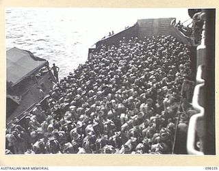 WEWAK HARBOUR, NEW GUINEA. 1945-10-26. A NEW UNIT, 67 INFANTRY BATTALION, WAS FORMED FROM VOLUNTEERS IN THE WEWAK AREA TO BECOME PART OF THE BRITISH COMMONWEALTH OCCUPATION FORCE (BCOF). THE UNIT ..