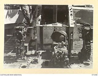 PORT MORESBY, NEW GUINEA. 1944-05-24. THE BEARING AND ELEVATION GEARS OF A GUN OF THE BASILISK BATTERY, 801ST ANTI-AIRCRAFT AND COAST ARTILLERY BATTERY AT HEADQUARTERS MORESBY BASE SUB-AREA. ..