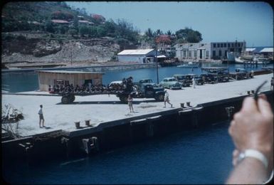 Approaching the wharf: the labourers are waiting on a truck : Port Moresby, Papua New Guinea, 1953 / Terence and Margaret Spencer