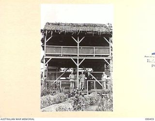 LAE, NEW GUINEA. 1945-04-08. A GROUP OUTSIDE THE COMMANDER-IN-CHIEF'S HUT, HEADQUARTERS FIRST ARMY, DURING THE VISIT OF MR J.M. FRASER, ACTING MINISTER FOR THE ARMY (4), AND MR SINCLAIR, SECRETARY, ..