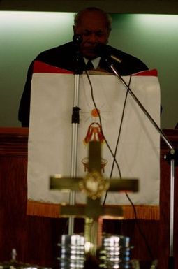 King Taufa'ahau Tupou IV speaking from the pulpit at the dedication of Vaine Mo'onia (The True Vine) church