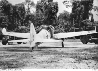 TOROKINA, BOUGAINVILLE, AUGUST 1945. A JAPANESE ZERO FIGHTER WHICH WAS FLOWN FROM SOUTH BOUGAINVILLE TO TOROKINA BY THE ROYAL NEW ZEALAND AIR FORCE AFTER THE SURRENDER OF JAPANESE FORCES. NOTE THE ..