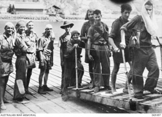 PORT MORESBY, NEW GUINEA. 1942-04-12. EVACUEES FROM NEW BRITAIN, COMPRISING SERVICE PERSONNEL AND CIVILIANS WHO WERE EVACUATED FROM PALMALMAL ON THE SOUTH COAST OF NEW BRITAIN BY THE HMAS ..