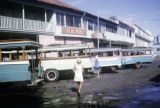 French Polynesia, buses parked along buildings in Papeete