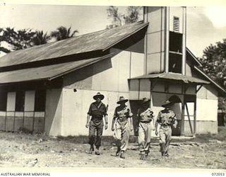 LAE, NEW GUINEA. 1944-04-03. MEMBERS OF HEADQUARTERS LAE BASE SUB-AREA OUTSIDE THE OLD MISSION CHURCH. THE CHURCH IS NOW BEING USED FOR RELIGIOUS SERVICES BY THE ARMY. IDENTIFIED PERSONNEL ARE:- ..