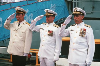 Vice Admiral (VADM) Ma Xin Chun, Commander of the Chinese North Sea Fleet (left), Admiral (ADM) David Jeremiah, Commander-in-CHIEF, US Pacific Fleet, (center), and VADM James Dorsey Jr., Commander, US Third Fleet, salute at ceremonies of the visiting Chinese training ship ZHENG HE