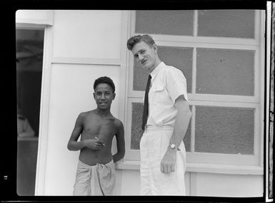 P Brett, Qantas Empire Airways Senior Traffic Officer and Andrew (Local Office Boy), Port Moresby, Papua New Guinea