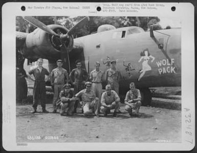 A crew of the 43rd Bomb Group poses beside the Consolidated B-24 "Wolf Pack" at Dobodura Airstrip, Papua, New Guinea. 9 February 1944. (U.S. Air Force Number 72376AC)