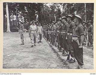 TOROKINA, BOUGAINVILLE. 1945-05-11. LIEUTENANT GENERAL V.A.H. STURDEE, GENERAL OFFICER COMMANDING FIRST ARMY (3), INSPECTING THE FRONT RANK OF A COMPANY, 25 INFANTRY BATTALION (A.I.F.). (FOR ..