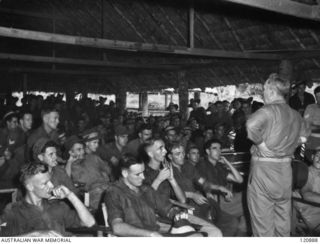 RABAUL, NEW BRITAIN. 1945-12-28. THE PRIME MINISTER OF AUSTRALIA, MR BEN CHIFLEY, ARRIVED BY PLANE TO VISIT MANY OF THE UNITS IN THE AREA. MR CHIFLEY TALKS TO TROOPS OF THE 11TH BATTALION IN THEIR ..